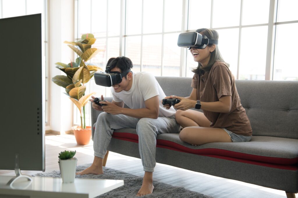 Couple playing video games at home